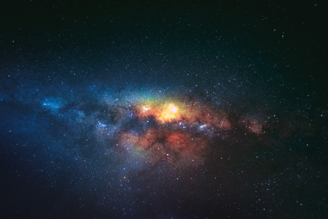 A solitary explorer stands on the edge of a stylized cosmic gateway, gazing into an infinite vista of swirling nebulae, glowing galaxies, and shimmering stardust, with a faint, luminous question mark subtly formed by gas clouds in the deep space beyond.