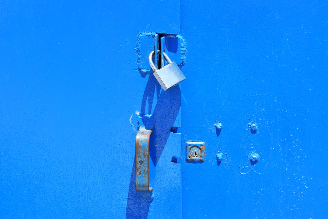 A stylized, glowing digital padlock, intricately integrated into a dynamic network of illuminated data streams, set against a dark, secure background.