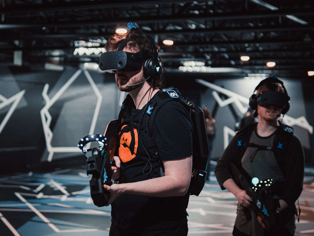 A human hand holding a sleek, glowing gaming controller, with vibrant, abstract digital data streams emanating from it and seamlessly merging into the intricate, interconnected patterns of a global network map, set against a dark, futuristic backdrop.