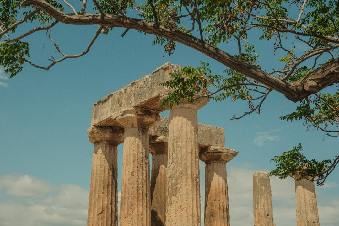 A majestic wide shot of diverse ancient ruins and magnificent historical landmarks, bathed in a timeless golden light, emphasizing their scale and intricate details across centuries.