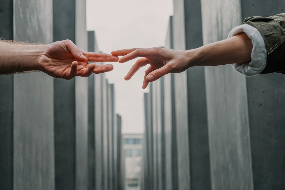 Dynamic, glowing lines representing different fields of knowledge converge and intertwine to form a vibrant, interconnected web that gently illuminates a diverse, collaborative group of individuals in a shared, modern space.