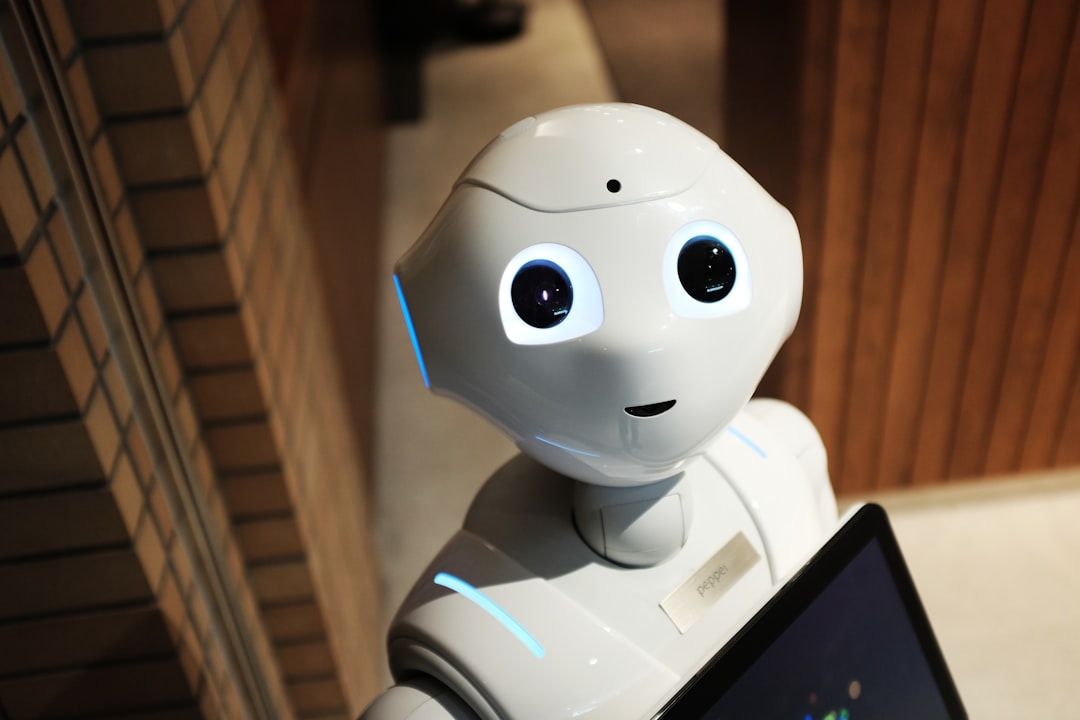A detailed close-up shot of a hyperrealistic humanoid robot's metallic hand gently reaching out to touch a human hand, with subtle blue digital circuitry visible beneath the robot's translucent skin.