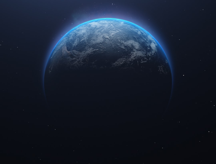 A radiant view of Earth from space, showcasing its blue oceans and land illuminated by a bright atmospheric glow against a dark, star-dusted cosmic background, ideal for Earth Day science education.