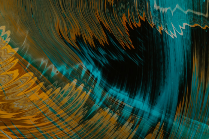 Immersive abstract art features swirling teal, golden, and black patterns, evoking the distorted spacetime near a black hole's event horizon for a virtual reality experience.