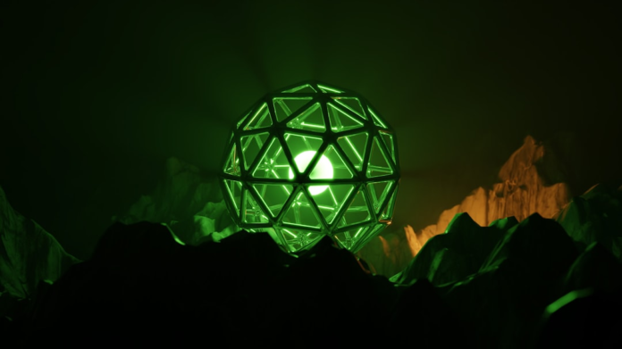 A glowing green geodesic sphere illuminates a dark, mysterious alien landscape of jagged peaks, representing a futuristic probe or discovery during the NASA Titan mission on Saturn's moon.
