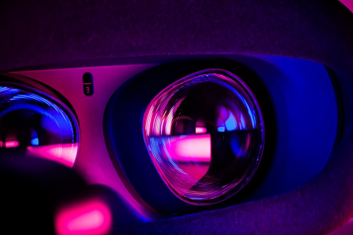Close-up of an AR/VR headset's illuminated lenses glowing in vibrant pink and blue, symbolizing immersive augmented and virtual reality gaming experiences.