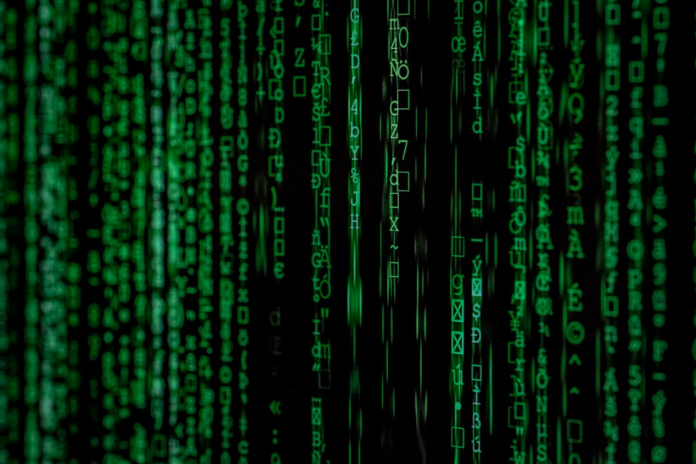 Vibrant green digital code, symbols, and numbers cascade down a dark screen, illustrating complex data, network security, or a blockchain ledger.